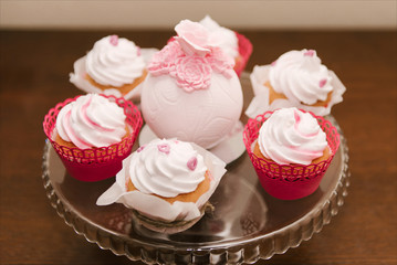 Red velvet cupcakes for Valentines Day in bright colorful setting, selection focus