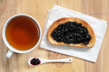 Tea and toasted bread with jam