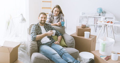 Couple relaxing during home renovation