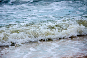 Strong waves crash over the beach at Sea of Azov