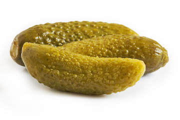 Pickled cucumbers, also known as gherkins or cornichons, isolated on white background