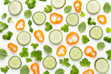 Vegetable and spices isolated on white background, top view. Wallpaper abstract composition of vegetables.
