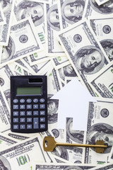 Fototapeta premium Cardboard house,calculator and keys