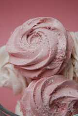 Close Up Pink Homemade Strawberry Marshmallows or Zephyr. Pink Desert over Pink Background. Copy Space.