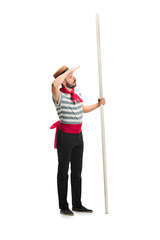 Caucasian man in traditional gondolier costume and hat