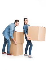 young couple relocating with carton boxes, isolated on white