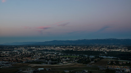Panoramic view on Valence city in Rhone-Alpes French region with mountains on a background during the sunset.