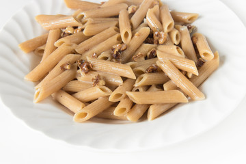 pasta with gorgonzola, detail of the dish (whole wheat "penne" with blue cheese and walnuts)