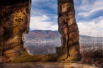 landscape of Lake Varese, through a broken wall,varese,Lombardy,Italy