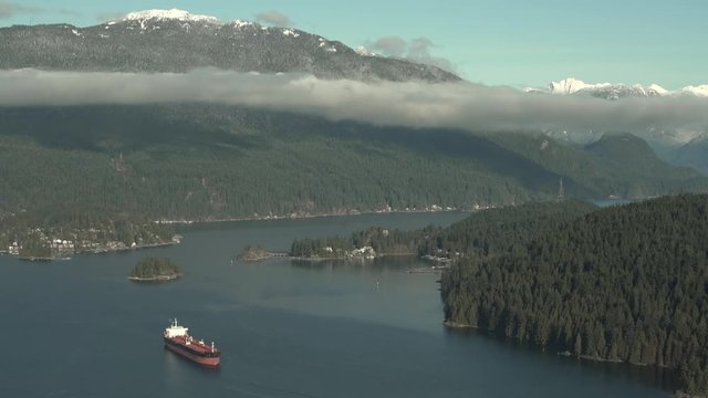 Burrard Oil Tanker, Coast Mountains 4K UHD. Oil tanker in Burrard Inlet. Vancouver, British Columbia, Canada.
