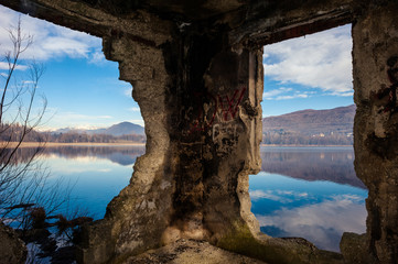 landscape of Lake Varese, through a broken wall,varese,Lombardy,Italy