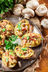 Baked potatoes stuffed with bacon, mushrooms and cheese