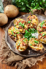 Baked potatoes stuffed with bacon, mushrooms and cheese