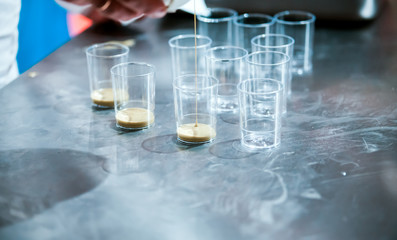 Confectioner preparing cream in pastry shop, food industry