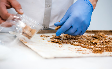 Confectioner preparing cookies, confectionery industry