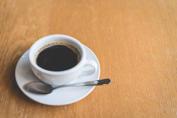 Coffee white cup , Black coffee on wood table ,warm and good smell