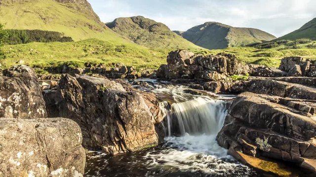Dolly shot time lapse with long time exposure of the paradisal waterfall landscape in Glen Etive, Scotland - United Kingdom