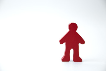 red wooden man figure on white background