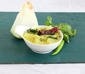 Majjige huli or pumpkin or ash gourd sambar, a traditional and popular south indian vegetarian...