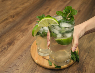 hand with a glass of drink
