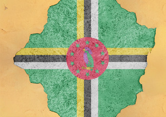 Dominica state flag broken material facade structure in big concrete cracked hole