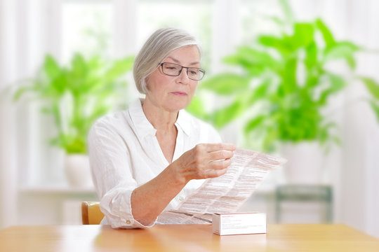 Woman Reading Drug Package Leaflet