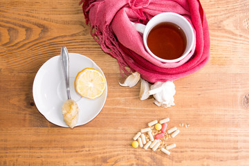 concept of healthy new and old ways of healing on a white background and wooden table from above