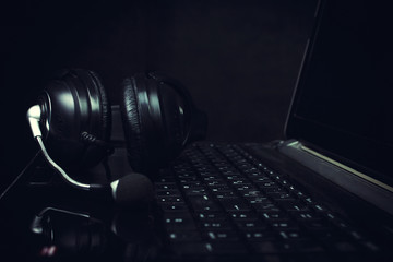 Obraz na płótnie Canvas Headphones on Laptop