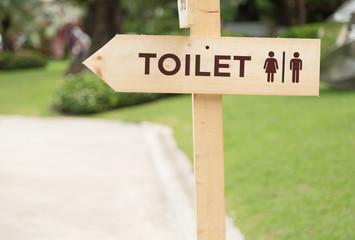 Wooden Toilet Sign in Garden
