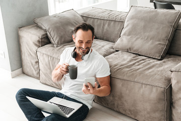 Fototapeta premium Laughing mature man talking on mobile phone