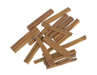 a lot of cinnamon sticks scattered on a white background