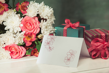Love background with pink roses, flowers, gift on table