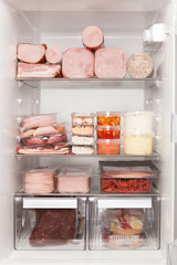 Full fridge of meat and ham. Unhealthy eating concept. © Eskymaks