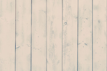 Vertical planks painted pink paint.