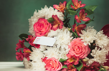 Love background with pink roses, flowers, gift on table