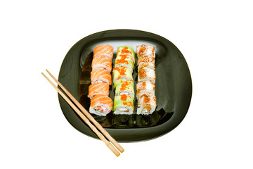 Black plate with various rolls.  Food concept. Isolated. White background