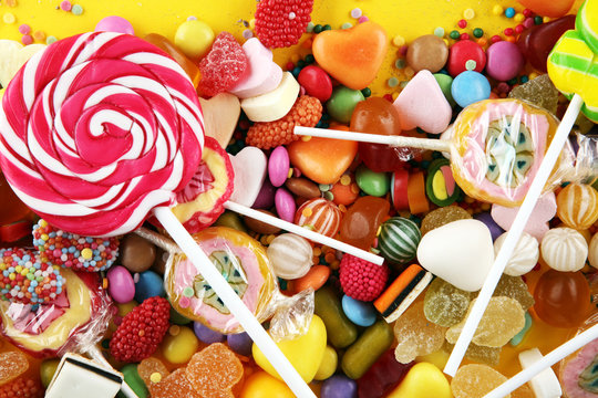 candies with jelly and sugar. colorful array of different childs sweets and treats.