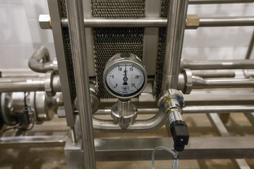 Fototapeta na wymiar Pressure gauge (manometer) of white metal - brewing equipment. Close-up, macro. 
