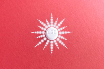 LSD drug luminous pattern of white spots a red background in the psychedelic drug trip