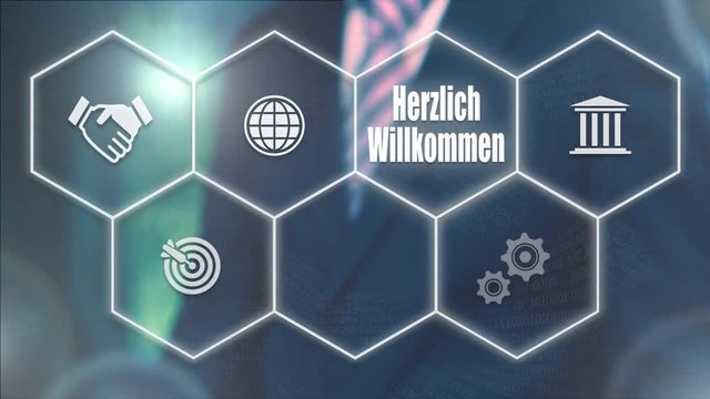 A businessman pressing a Welcome "Herzlich-Willkommen" button in German on a futuristic computer  display