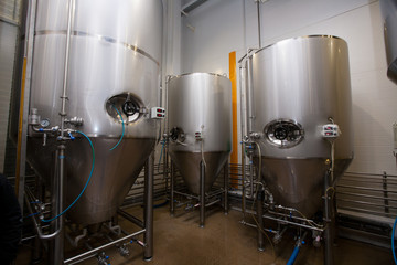 Huge Tanks of white metal, which brewed beer in the brewery
