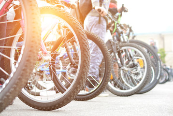 Bicycle wheels. A group of cyclists. Bicycle tour