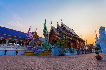 Naklejka premium Wat Den Sari Sri Muaeng Kaen in Mae Tang Chiang Mai. Beautiful with Thai and Burmese Buddhism architecture and guarding animal sculptures at staircases. One of the should see temple in Chiang Mai.