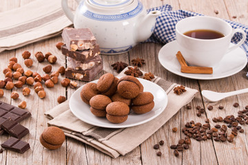 Hazelnut shortbread sandwiches filled with chocolate cream. 