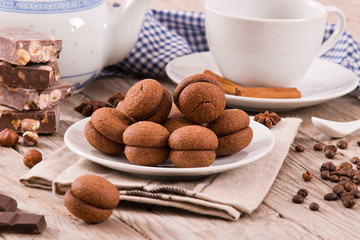 Hazelnut shortbread sandwiches filled with chocolate cream. 