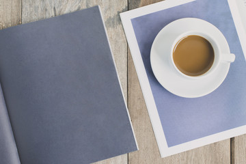 top view a cup of coffee with paper and note book