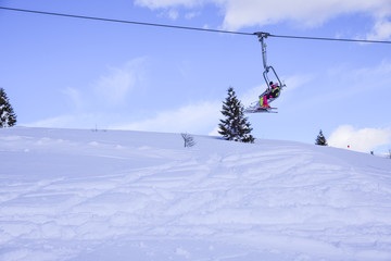 Fototapeta na wymiar skilifts in the Alps on a sunny winter day