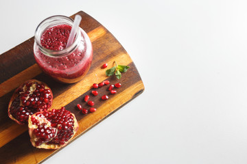 freshly prepared smoothies from banana and pomegranate. Diet, a healthy lifestyle