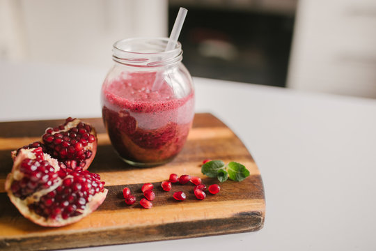 freshly prepared smoothies from banana and pomegranate. Diet, a healthy lifestyle