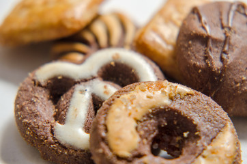 assorted cookies on wooden tray